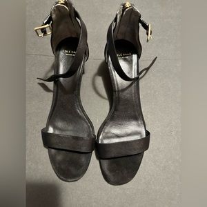 Black low heels sandals .